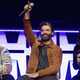 John Boyega, Oscar Isaac and Kelly Marie Tran on stage
